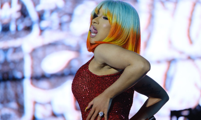 Cardi B sticks her tongue out